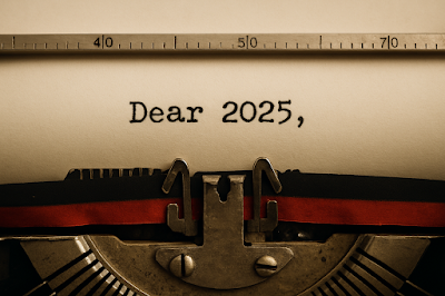 Typewriter paper with Dear 2025, typed, ruler above and ribbon below, evoking a reflective New Year message.